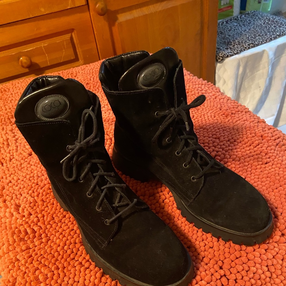 Black suede lug sole boots.